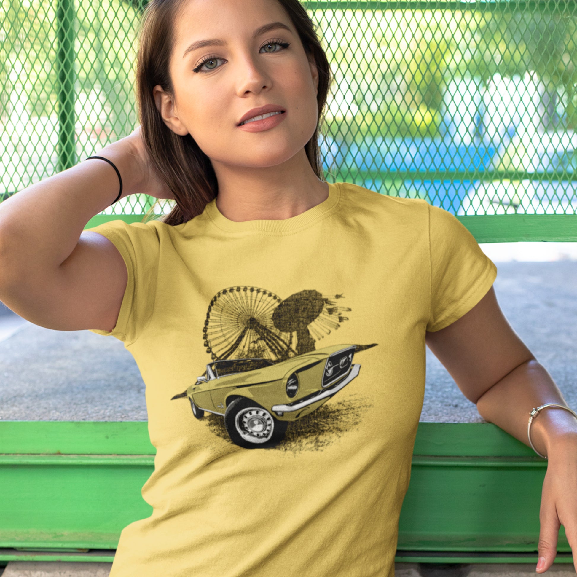 Classic car shirt featuring Yellow 68 Ford Mustang - Unisex t-shirt with 1968 Mustang convertible against carnival backdrop